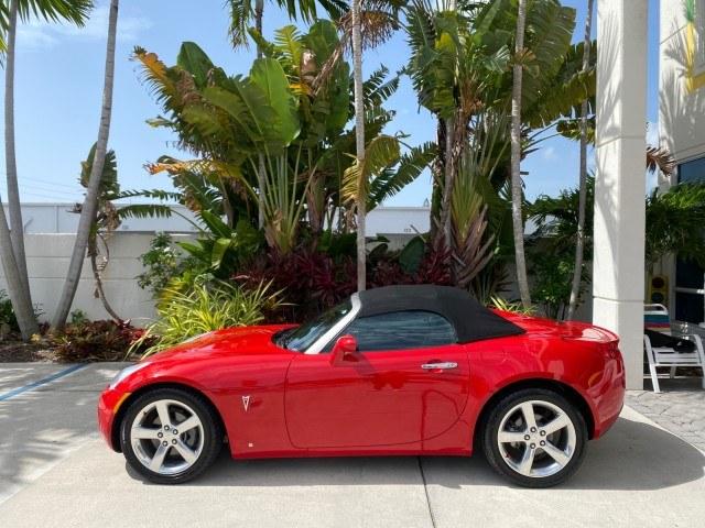 2007 Aggressive (Victory Red) /Ebony Pontiac Solstice LOW MILES 38,147 5SPD AC (1G2MB35B77Y) with an Ecotec 2.4L VVT DOHC 4-Cyl SFI Aluminum Engine engine, Manual transmission, located at 4701 North Dixie Hwy, Pompano Beach, FL, 33064, (954) 422-2889, 26.240938, -80.123474 - OUR WEBPAGE FLORIDACARS1.COM HAS OVER 100 PHOTOS AND FREE CARFAX LINK 2007 Pontiac Solstice Convertible 2.4L I4 F DOHC Gasoline 28 MPG Rear Wheel Drive Features Air Conditioning Alloy Wheels AM/FM Stereo Auxiliary Audio Input CD Audio Cruise Control Leather Seats Manual Transmission Power Locks Powe- Photo#30