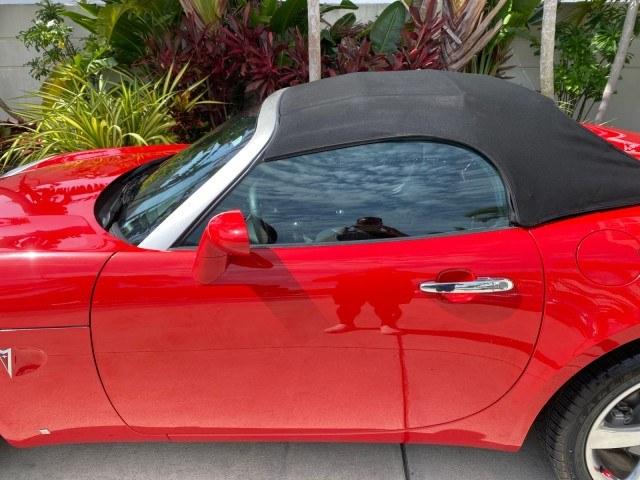2007 Aggressive (Victory Red) /Ebony Pontiac Solstice LOW MILES 38,147 5SPD AC (1G2MB35B77Y) with an Ecotec 2.4L VVT DOHC 4-Cyl SFI Aluminum Engine engine, Manual transmission, located at 4701 North Dixie Hwy, Pompano Beach, FL, 33064, (954) 422-2889, 26.240938, -80.123474 - OUR WEBPAGE FLORIDACARS1.COM HAS OVER 100 PHOTOS AND FREE CARFAX LINK 2007 Pontiac Solstice Convertible 2.4L I4 F DOHC Gasoline 28 MPG Rear Wheel Drive Features Air Conditioning Alloy Wheels AM/FM Stereo Auxiliary Audio Input CD Audio Cruise Control Leather Seats Manual Transmission Power Locks Powe- Photo#36