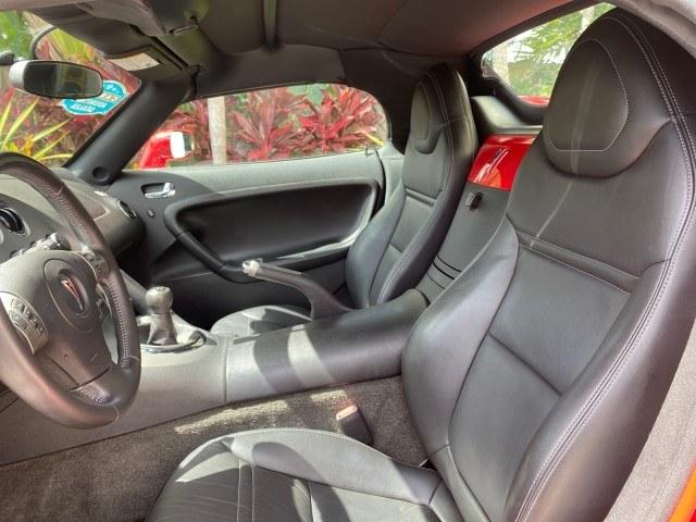 2007 Aggressive (Victory Red) /Ebony Pontiac Solstice LOW MILES 38,147 5SPD AC (1G2MB35B77Y) with an Ecotec 2.4L VVT DOHC 4-Cyl SFI Aluminum Engine engine, Manual transmission, located at 4701 North Dixie Hwy, Pompano Beach, FL, 33064, (954) 422-2889, 26.240938, -80.123474 - OUR WEBPAGE FLORIDACARS1.COM HAS OVER 100 PHOTOS AND FREE CARFAX LINK 2007 Pontiac Solstice Convertible 2.4L I4 F DOHC Gasoline 28 MPG Rear Wheel Drive Features Air Conditioning Alloy Wheels AM/FM Stereo Auxiliary Audio Input CD Audio Cruise Control Leather Seats Manual Transmission Power Locks Powe- Photo#44