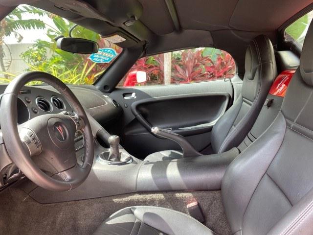 2007 Aggressive (Victory Red) /Ebony Pontiac Solstice LOW MILES 38,147 5SPD AC (1G2MB35B77Y) with an Ecotec 2.4L VVT DOHC 4-Cyl SFI Aluminum Engine engine, Manual transmission, located at 4701 North Dixie Hwy, Pompano Beach, FL, 33064, (954) 422-2889, 26.240938, -80.123474 - OUR WEBPAGE FLORIDACARS1.COM HAS OVER 100 PHOTOS AND FREE CARFAX LINK 2007 Pontiac Solstice Convertible 2.4L I4 F DOHC Gasoline 28 MPG Rear Wheel Drive Features Air Conditioning Alloy Wheels AM/FM Stereo Auxiliary Audio Input CD Audio Cruise Control Leather Seats Manual Transmission Power Locks Powe- Photo#46