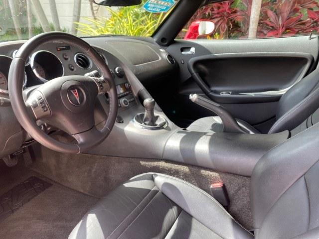 2007 Aggressive (Victory Red) /Ebony Pontiac Solstice LOW MILES 38,147 5SPD AC (1G2MB35B77Y) with an Ecotec 2.4L VVT DOHC 4-Cyl SFI Aluminum Engine engine, Manual transmission, located at 4701 North Dixie Hwy, Pompano Beach, FL, 33064, (954) 422-2889, 26.240938, -80.123474 - OUR WEBPAGE FLORIDACARS1.COM HAS OVER 100 PHOTOS AND FREE CARFAX LINK 2007 Pontiac Solstice Convertible 2.4L I4 F DOHC Gasoline 28 MPG Rear Wheel Drive Features Air Conditioning Alloy Wheels AM/FM Stereo Auxiliary Audio Input CD Audio Cruise Control Leather Seats Manual Transmission Power Locks Powe- Photo#47