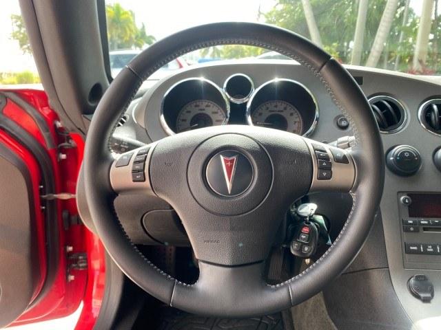 2007 Aggressive (Victory Red) /Ebony Pontiac Solstice LOW MILES 38,147 5SPD AC (1G2MB35B77Y) with an Ecotec 2.4L VVT DOHC 4-Cyl SFI Aluminum Engine engine, Manual transmission, located at 4701 North Dixie Hwy, Pompano Beach, FL, 33064, (954) 422-2889, 26.240938, -80.123474 - OUR WEBPAGE FLORIDACARS1.COM HAS OVER 100 PHOTOS AND FREE CARFAX LINK 2007 Pontiac Solstice Convertible 2.4L I4 F DOHC Gasoline 28 MPG Rear Wheel Drive Features Air Conditioning Alloy Wheels AM/FM Stereo Auxiliary Audio Input CD Audio Cruise Control Leather Seats Manual Transmission Power Locks Powe- Photo#50