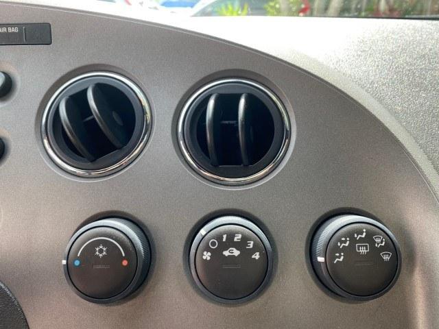 2007 Aggressive (Victory Red) /Ebony Pontiac Solstice LOW MILES 38,147 5SPD AC (1G2MB35B77Y) with an Ecotec 2.4L VVT DOHC 4-Cyl SFI Aluminum Engine engine, Manual transmission, located at 4701 North Dixie Hwy, Pompano Beach, FL, 33064, (954) 422-2889, 26.240938, -80.123474 - OUR WEBPAGE FLORIDACARS1.COM HAS OVER 100 PHOTOS AND FREE CARFAX LINK 2007 Pontiac Solstice Convertible 2.4L I4 F DOHC Gasoline 28 MPG Rear Wheel Drive Features Air Conditioning Alloy Wheels AM/FM Stereo Auxiliary Audio Input CD Audio Cruise Control Leather Seats Manual Transmission Power Locks Powe- Photo#58