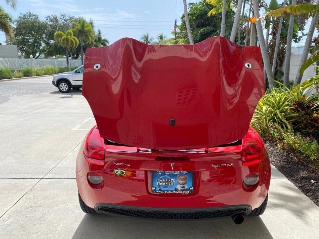 2007 Aggressive (Victory Red) /Ebony Pontiac Solstice LOW MILES 38,147 5SPD AC (1G2MB35B77Y) with an Ecotec 2.4L VVT DOHC 4-Cyl SFI Aluminum Engine engine, Manual transmission, located at 4701 North Dixie Hwy, Pompano Beach, FL, 33064, (954) 422-2889, 26.240938, -80.123474 - OUR WEBPAGE FLORIDACARS1.COM HAS OVER 100 PHOTOS AND FREE CARFAX LINK 2007 Pontiac Solstice Convertible 2.4L I4 F DOHC Gasoline 28 MPG Rear Wheel Drive Features Air Conditioning Alloy Wheels AM/FM Stereo Auxiliary Audio Input CD Audio Cruise Control Leather Seats Manual Transmission Power Locks Powe- Photo#79