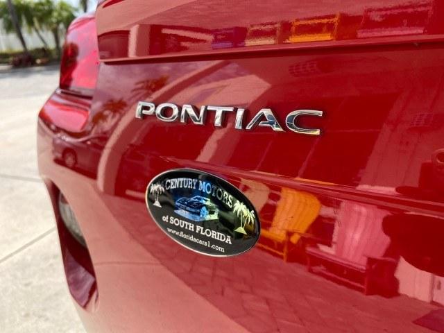 2007 Aggressive (Victory Red) /Ebony Pontiac Solstice LOW MILES 38,147 5SPD AC (1G2MB35B77Y) with an Ecotec 2.4L VVT DOHC 4-Cyl SFI Aluminum Engine engine, Manual transmission, located at 4701 North Dixie Hwy, Pompano Beach, FL, 33064, (954) 422-2889, 26.240938, -80.123474 - OUR WEBPAGE FLORIDACARS1.COM HAS OVER 100 PHOTOS AND FREE CARFAX LINK 2007 Pontiac Solstice Convertible 2.4L I4 F DOHC Gasoline 28 MPG Rear Wheel Drive Features Air Conditioning Alloy Wheels AM/FM Stereo Auxiliary Audio Input CD Audio Cruise Control Leather Seats Manual Transmission Power Locks Powe- Photo#80