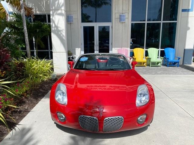 2007 Aggressive (Victory Red) /Ebony Pontiac Solstice LOW MILES 38,147 5SPD AC (1G2MB35B77Y) with an Ecotec 2.4L VVT DOHC 4-Cyl SFI Aluminum Engine engine, Manual transmission, located at 4701 North Dixie Hwy, Pompano Beach, FL, 33064, (954) 422-2889, 26.240938, -80.123474 - OUR WEBPAGE FLORIDACARS1.COM HAS OVER 100 PHOTOS AND FREE CARFAX LINK 2007 Pontiac Solstice Convertible 2.4L I4 F DOHC Gasoline 28 MPG Rear Wheel Drive Features Air Conditioning Alloy Wheels AM/FM Stereo Auxiliary Audio Input CD Audio Cruise Control Leather Seats Manual Transmission Power Locks Powe- Photo#85
