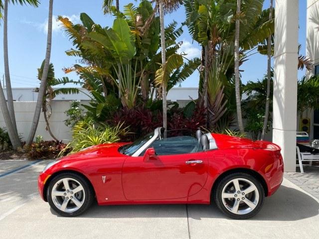 2007 Aggressive (Victory Red) /Ebony Pontiac Solstice LOW MILES 38,147 5SPD AC (1G2MB35B77Y) with an Ecotec 2.4L VVT DOHC 4-Cyl SFI Aluminum Engine engine, Manual transmission, located at 4701 North Dixie Hwy, Pompano Beach, FL, 33064, (954) 422-2889, 26.240938, -80.123474 - OUR WEBPAGE FLORIDACARS1.COM HAS OVER 100 PHOTOS AND FREE CARFAX LINK 2007 Pontiac Solstice Convertible 2.4L I4 F DOHC Gasoline 28 MPG Rear Wheel Drive Features Air Conditioning Alloy Wheels AM/FM Stereo Auxiliary Audio Input CD Audio Cruise Control Leather Seats Manual Transmission Power Locks Powe- Photo#89