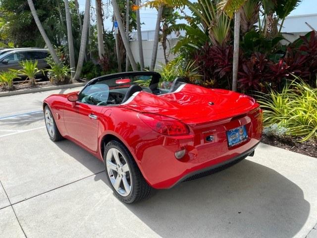 2007 Aggressive (Victory Red) /Ebony Pontiac Solstice LOW MILES 38,147 5SPD AC (1G2MB35B77Y) with an Ecotec 2.4L VVT DOHC 4-Cyl SFI Aluminum Engine engine, Manual transmission, located at 4701 North Dixie Hwy, Pompano Beach, FL, 33064, (954) 422-2889, 26.240938, -80.123474 - OUR WEBPAGE FLORIDACARS1.COM HAS OVER 100 PHOTOS AND FREE CARFAX LINK 2007 Pontiac Solstice Convertible 2.4L I4 F DOHC Gasoline 28 MPG Rear Wheel Drive Features Air Conditioning Alloy Wheels AM/FM Stereo Auxiliary Audio Input CD Audio Cruise Control Leather Seats Manual Transmission Power Locks Powe- Photo#91