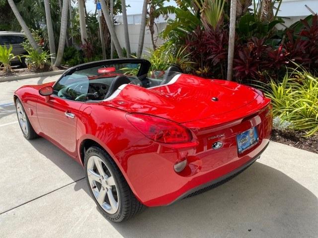 2007 Aggressive (Victory Red) /Ebony Pontiac Solstice LOW MILES 38,147 5SPD AC (1G2MB35B77Y) with an Ecotec 2.4L VVT DOHC 4-Cyl SFI Aluminum Engine engine, Manual transmission, located at 4701 North Dixie Hwy, Pompano Beach, FL, 33064, (954) 422-2889, 26.240938, -80.123474 - OUR WEBPAGE FLORIDACARS1.COM HAS OVER 100 PHOTOS AND FREE CARFAX LINK 2007 Pontiac Solstice Convertible 2.4L I4 F DOHC Gasoline 28 MPG Rear Wheel Drive Features Air Conditioning Alloy Wheels AM/FM Stereo Auxiliary Audio Input CD Audio Cruise Control Leather Seats Manual Transmission Power Locks Powe- Photo#92