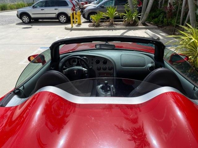 2007 Aggressive (Victory Red) /Ebony Pontiac Solstice LOW MILES 38,147 5SPD AC (1G2MB35B77Y) with an Ecotec 2.4L VVT DOHC 4-Cyl SFI Aluminum Engine engine, Manual transmission, located at 4701 North Dixie Hwy, Pompano Beach, FL, 33064, (954) 422-2889, 26.240938, -80.123474 - OUR WEBPAGE FLORIDACARS1.COM HAS OVER 100 PHOTOS AND FREE CARFAX LINK 2007 Pontiac Solstice Convertible 2.4L I4 F DOHC Gasoline 28 MPG Rear Wheel Drive Features Air Conditioning Alloy Wheels AM/FM Stereo Auxiliary Audio Input CD Audio Cruise Control Leather Seats Manual Transmission Power Locks Powe- Photo#95