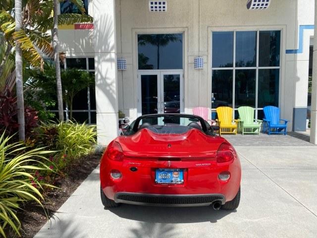 2007 Aggressive (Victory Red) /Ebony Pontiac Solstice LOW MILES 38,147 5SPD AC (1G2MB35B77Y) with an Ecotec 2.4L VVT DOHC 4-Cyl SFI Aluminum Engine engine, Manual transmission, located at 4701 North Dixie Hwy, Pompano Beach, FL, 33064, (954) 422-2889, 26.240938, -80.123474 - OUR WEBPAGE FLORIDACARS1.COM HAS OVER 100 PHOTOS AND FREE CARFAX LINK 2007 Pontiac Solstice Convertible 2.4L I4 F DOHC Gasoline 28 MPG Rear Wheel Drive Features Air Conditioning Alloy Wheels AM/FM Stereo Auxiliary Audio Input CD Audio Cruise Control Leather Seats Manual Transmission Power Locks Powe- Photo#99