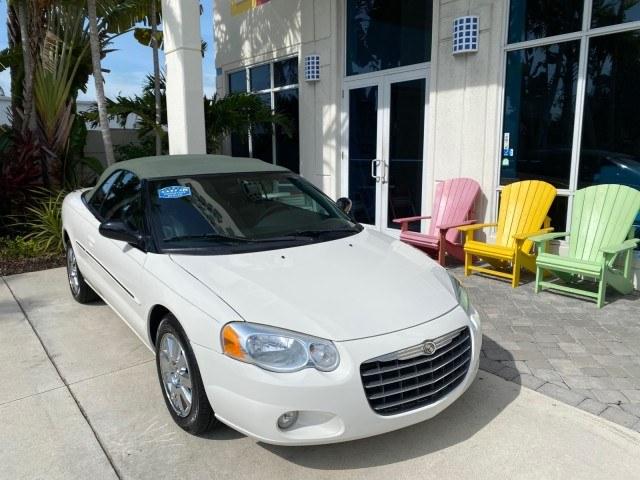 2004 Stone White /Dark Slate Gray Chrysler Sebring Limited LOW MILES 65,491 (1C3EL65R14N) with an 2.7L MPI DOHC 24-Valve V6 Engine engine, Automatic transmission, located at 4701 North Dixie Hwy, Pompano Beach, FL, 33064, (954) 422-2889, 26.240938, -80.123474 - OUR WEBPAGE FLORIDACARS1.COM HAS OVER 100 PHOTOS AND FREE CARFAX LINK 2004 Chrysler Sebring Limited Convertible 2.7L V6 F DOHC Gasoline 28 MPG Front Wheel Drive Features ABS Brakes Air Conditioning Alloy Wheels AM/FM Stereo Automatic Transmission CD Audio Cruise Control Infinity Sound System Leather- Photo#1