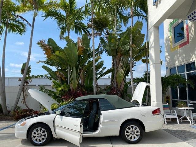 2004 Stone White /Dark Slate Gray Chrysler Sebring Limited LOW MILES 65,491 (1C3EL65R14N) with an 2.7L MPI DOHC 24-Valve V6 Engine engine, Automatic transmission, located at 4701 North Dixie Hwy, Pompano Beach, FL, 33064, (954) 422-2889, 26.240938, -80.123474 - OUR WEBPAGE FLORIDACARS1.COM HAS OVER 100 PHOTOS AND FREE CARFAX LINK 2004 Chrysler Sebring Limited Convertible 2.7L V6 F DOHC Gasoline 28 MPG Front Wheel Drive Features ABS Brakes Air Conditioning Alloy Wheels AM/FM Stereo Automatic Transmission CD Audio Cruise Control Infinity Sound System Leather- Photo#8