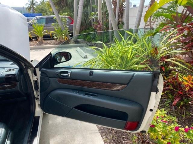 2004 Stone White /Dark Slate Gray Chrysler Sebring Limited LOW MILES 65,491 (1C3EL65R14N) with an 2.7L MPI DOHC 24-Valve V6 Engine engine, Automatic transmission, located at 4701 North Dixie Hwy, Pompano Beach, FL, 33064, (954) 422-2889, 26.240938, -80.123474 - OUR WEBPAGE FLORIDACARS1.COM HAS OVER 100 PHOTOS AND FREE CARFAX LINK 2004 Chrysler Sebring Limited Convertible 2.7L V6 F DOHC Gasoline 28 MPG Front Wheel Drive Features ABS Brakes Air Conditioning Alloy Wheels AM/FM Stereo Automatic Transmission CD Audio Cruise Control Infinity Sound System Leather- Photo#11
