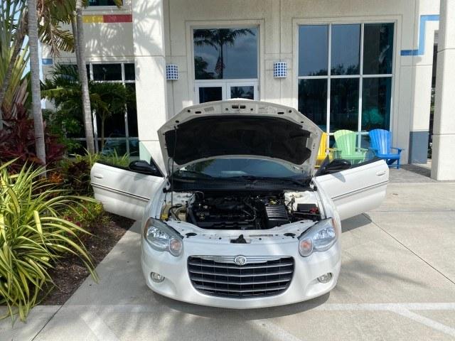 2004 Stone White /Dark Slate Gray Chrysler Sebring Limited LOW MILES 65,491 (1C3EL65R14N) with an 2.7L MPI DOHC 24-Valve V6 Engine engine, Automatic transmission, located at 4701 North Dixie Hwy, Pompano Beach, FL, 33064, (954) 422-2889, 26.240938, -80.123474 - OUR WEBPAGE FLORIDACARS1.COM HAS OVER 100 PHOTOS AND FREE CARFAX LINK 2004 Chrysler Sebring Limited Convertible 2.7L V6 F DOHC Gasoline 28 MPG Front Wheel Drive Features ABS Brakes Air Conditioning Alloy Wheels AM/FM Stereo Automatic Transmission CD Audio Cruise Control Infinity Sound System Leather- Photo#16