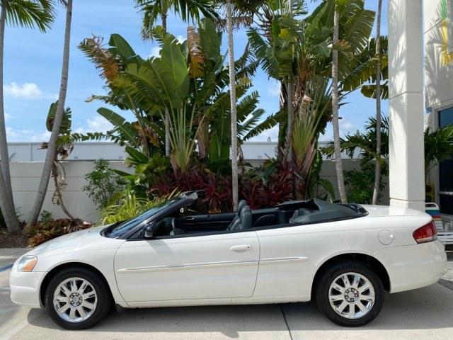 2004 Stone White /Dark Slate Gray Chrysler Sebring Limited LOW MILES 65,491 (1C3EL65R14N) with an 2.7L MPI DOHC 24-Valve V6 Engine engine, Automatic transmission, located at 4701 North Dixie Hwy, Pompano Beach, FL, 33064, (954) 422-2889, 26.240938, -80.123474 - OUR WEBPAGE FLORIDACARS1.COM HAS OVER 100 PHOTOS AND FREE CARFAX LINK 2004 Chrysler Sebring Limited Convertible 2.7L V6 F DOHC Gasoline 28 MPG Front Wheel Drive Features ABS Brakes Air Conditioning Alloy Wheels AM/FM Stereo Automatic Transmission CD Audio Cruise Control Infinity Sound System Leather- Photo#37