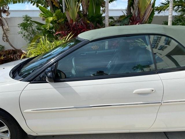 2004 Stone White /Dark Slate Gray Chrysler Sebring Limited LOW MILES 65,491 (1C3EL65R14N) with an 2.7L MPI DOHC 24-Valve V6 Engine engine, Automatic transmission, located at 4701 North Dixie Hwy, Pompano Beach, FL, 33064, (954) 422-2889, 26.240938, -80.123474 - OUR WEBPAGE FLORIDACARS1.COM HAS OVER 100 PHOTOS AND FREE CARFAX LINK 2004 Chrysler Sebring Limited Convertible 2.7L V6 F DOHC Gasoline 28 MPG Front Wheel Drive Features ABS Brakes Air Conditioning Alloy Wheels AM/FM Stereo Automatic Transmission CD Audio Cruise Control Infinity Sound System Leather- Photo#47