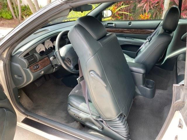 2004 Stone White /Dark Slate Gray Chrysler Sebring Limited LOW MILES 65,491 (1C3EL65R14N) with an 2.7L MPI DOHC 24-Valve V6 Engine engine, Automatic transmission, located at 4701 North Dixie Hwy, Pompano Beach, FL, 33064, (954) 422-2889, 26.240938, -80.123474 - OUR WEBPAGE FLORIDACARS1.COM HAS OVER 100 PHOTOS AND FREE CARFAX LINK 2004 Chrysler Sebring Limited Convertible 2.7L V6 F DOHC Gasoline 28 MPG Front Wheel Drive Features ABS Brakes Air Conditioning Alloy Wheels AM/FM Stereo Automatic Transmission CD Audio Cruise Control Infinity Sound System Leather- Photo#83