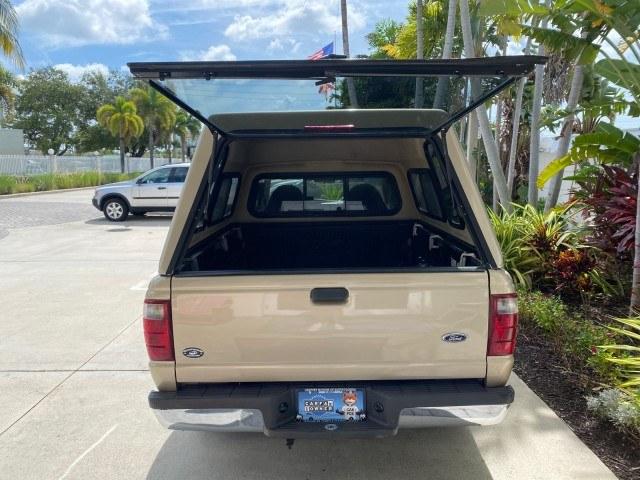 2002 Harvest Gold Metallic /Med Prairie Tan Ford Ranger XLT X CAB CAMPER TOP LOW MILES 49,062 (1FTYR44E22P) with an 4.0L SEFI SOHC V6 Engine engine, Automatic transmission, located at 4701 North Dixie Hwy, Pompano Beach, FL, 33064, (954) 422-2889, 26.240938, -80.123474 - OUR WEBPAGE FLORIDACARS1.COM HAS OVER 100 PHOTOS AND FREE CARFAX LINK 2002 Ford Ranger XLT Appearance 4 Door Extended Cab Pickup 4.0L V6 F SOHC Gasoline 23 MPG Rear Wheel Drive Features ABS Brakes Air Conditioning AM/FM Stereo Automatic Transmission Bed Liner Cassette Player CD Audio Cloth Seats Cru- Photo#87