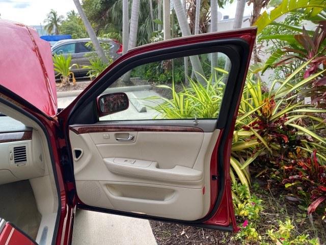 2006 Crimson Pearl /Shale Cadillac DTS w/1SC LOW MILES 49863 SUNROOF PEARL RED (1G6KD57Y26U) with an 4.6L DOHC V8 Northstar Engine engine, Automatic transmission, located at 4701 North Dixie Hwy, Pompano Beach, FL, 33064, (954) 422-2889, 26.240938, -80.123474 - OUR WEBPAGE FLORIDACARS1.COM HAS OVER 100 PHOTOS AND FREE CARFAX LINK 2006 Cadillac DTS Luxury Sedan 4 DR 4.6L V8 F Gasoline 25 MPG Front Wheel Drive Features A/C Seat(s) ABS Brakes Air Conditioning Alloy Wheels AM/FM Stereo Automatic Transmission Auxiliary Audio Input Bluetooth Technology CD Audio- Photo#11