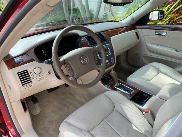 2006 Crimson Pearl /Shale Cadillac DTS w/1SC LOW MILES 49863 SUNROOF PEARL RED (1G6KD57Y26U) with an 4.6L DOHC V8 Northstar Engine engine, Automatic transmission, located at 4701 North Dixie Hwy, Pompano Beach, FL, 33064, (954) 422-2889, 26.240938, -80.123474 - OUR WEBPAGE FLORIDACARS1.COM HAS OVER 100 PHOTOS AND FREE CARFAX LINK 2006 Cadillac DTS Luxury Sedan 4 DR 4.6L V8 F Gasoline 25 MPG Front Wheel Drive Features A/C Seat(s) ABS Brakes Air Conditioning Alloy Wheels AM/FM Stereo Automatic Transmission Auxiliary Audio Input Bluetooth Technology CD Audio- Photo#49