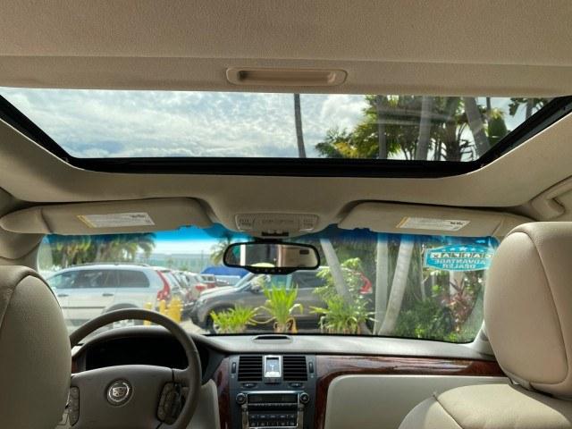 2006 Crimson Pearl /Shale Cadillac DTS w/1SC LOW MILES 49863 SUNROOF PEARL RED (1G6KD57Y26U) with an 4.6L DOHC V8 Northstar Engine engine, Automatic transmission, located at 4701 North Dixie Hwy, Pompano Beach, FL, 33064, (954) 422-2889, 26.240938, -80.123474 - OUR WEBPAGE FLORIDACARS1.COM HAS OVER 100 PHOTOS AND FREE CARFAX LINK 2006 Cadillac DTS Luxury Sedan 4 DR 4.6L V8 F Gasoline 25 MPG Front Wheel Drive Features A/C Seat(s) ABS Brakes Air Conditioning Alloy Wheels AM/FM Stereo Automatic Transmission Auxiliary Audio Input Bluetooth Technology CD Audio- Photo#92