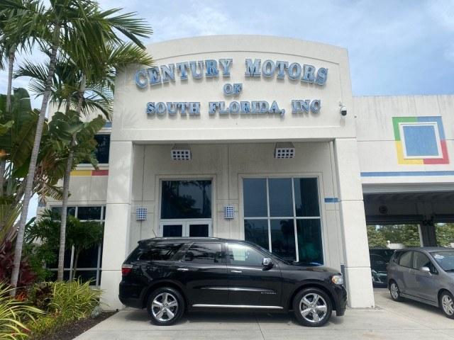 2011 Brilliant Black Crystal Pearl /Black/Tan Dodge Durango Citadel 4WD LOW MILES 60,759 (1D4SD5GTXBC) with an 5.7L V8 VVT Hemi Multi Displacement Engine engine, Automatic transmission, located at 4701 North Dixie Hwy, Pompano Beach, FL, 33064, (954) 422-2889, 26.240938, -80.123474 - OUR WEBPAGE FLORIDACARS1.COM HAS OVER 100 PHOTOS AND FREE CARFAX LINK 2011 Dodge Durango Citadel 4 Door Wagon/Sport Utility 5.7L V8 F OHV 16V Gasoline 20 MPG Rear Wheel Drive Features 20 Inch Plus Wheels 4WD/AWD A/C Seat(s) ABS Brakes Air Conditioning Alloy Wheels AM/FM Stereo Automated Cruise Contr- Photo#0