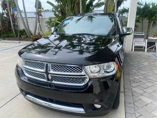 2011 Brilliant Black Crystal Pearl /Black/Tan Dodge Durango Citadel 4WD LOW MILES 60,759 (1D4SD5GTXBC) with an 5.7L V8 VVT Hemi Multi Displacement Engine engine, Automatic transmission, located at 4701 North Dixie Hwy, Pompano Beach, FL, 33064, (954) 422-2889, 26.240938, -80.123474 - OUR WEBPAGE FLORIDACARS1.COM HAS OVER 100 PHOTOS AND FREE CARFAX LINK 2011 Dodge Durango Citadel 4 Door Wagon/Sport Utility 5.7L V8 F OHV 16V Gasoline 20 MPG Rear Wheel Drive Features 20 Inch Plus Wheels 4WD/AWD A/C Seat(s) ABS Brakes Air Conditioning Alloy Wheels AM/FM Stereo Automated Cruise Contr- Photo#3