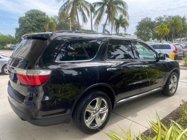 2011 Brilliant Black Crystal Pearl /Black/Tan Dodge Durango Citadel 4WD LOW MILES 60,759 (1D4SD5GTXBC) with an 5.7L V8 VVT Hemi Multi Displacement Engine engine, Automatic transmission, located at 4701 North Dixie Hwy, Pompano Beach, FL, 33064, (954) 422-2889, 26.240938, -80.123474 - OUR WEBPAGE FLORIDACARS1.COM HAS OVER 100 PHOTOS AND FREE CARFAX LINK 2011 Dodge Durango Citadel 4 Door Wagon/Sport Utility 5.7L V8 F OHV 16V Gasoline 20 MPG Rear Wheel Drive Features 20 Inch Plus Wheels 4WD/AWD A/C Seat(s) ABS Brakes Air Conditioning Alloy Wheels AM/FM Stereo Automated Cruise Contr- Photo#7