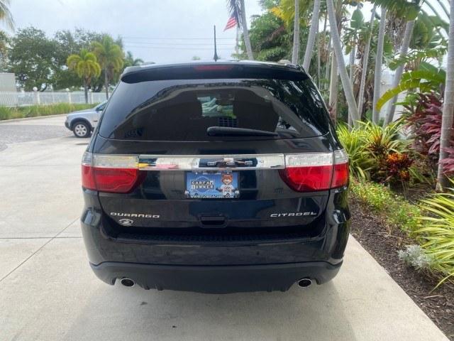 2011 Brilliant Black Crystal Pearl /Black/Tan Dodge Durango Citadel 4WD LOW MILES 60,759 (1D4SD5GTXBC) with an 5.7L V8 VVT Hemi Multi Displacement Engine engine, Automatic transmission, located at 4701 North Dixie Hwy, Pompano Beach, FL, 33064, (954) 422-2889, 26.240938, -80.123474 - OUR WEBPAGE FLORIDACARS1.COM HAS OVER 100 PHOTOS AND FREE CARFAX LINK 2011 Dodge Durango Citadel 4 Door Wagon/Sport Utility 5.7L V8 F OHV 16V Gasoline 20 MPG Rear Wheel Drive Features 20 Inch Plus Wheels 4WD/AWD A/C Seat(s) ABS Brakes Air Conditioning Alloy Wheels AM/FM Stereo Automated Cruise Contr- Photo#33