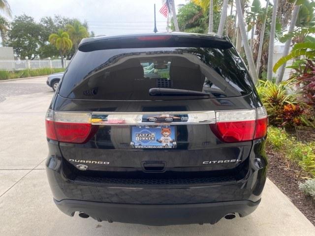 2011 Brilliant Black Crystal Pearl /Black/Tan Dodge Durango Citadel 4WD LOW MILES 60,759 (1D4SD5GTXBC) with an 5.7L V8 VVT Hemi Multi Displacement Engine engine, Automatic transmission, located at 4701 North Dixie Hwy, Pompano Beach, FL, 33064, (954) 422-2889, 26.240938, -80.123474 - OUR WEBPAGE FLORIDACARS1.COM HAS OVER 100 PHOTOS AND FREE CARFAX LINK 2011 Dodge Durango Citadel 4 Door Wagon/Sport Utility 5.7L V8 F OHV 16V Gasoline 20 MPG Rear Wheel Drive Features 20 Inch Plus Wheels 4WD/AWD A/C Seat(s) ABS Brakes Air Conditioning Alloy Wheels AM/FM Stereo Automated Cruise Contr- Photo#34