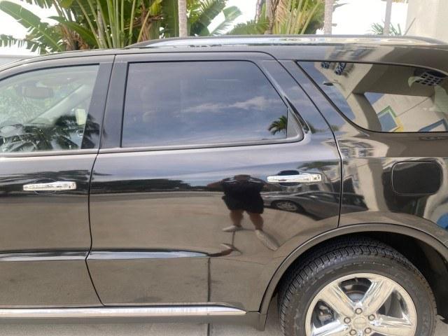 2011 Brilliant Black Crystal Pearl /Black/Tan Dodge Durango Citadel 4WD LOW MILES 60,759 (1D4SD5GTXBC) with an 5.7L V8 VVT Hemi Multi Displacement Engine engine, Automatic transmission, located at 4701 North Dixie Hwy, Pompano Beach, FL, 33064, (954) 422-2889, 26.240938, -80.123474 - OUR WEBPAGE FLORIDACARS1.COM HAS OVER 100 PHOTOS AND FREE CARFAX LINK 2011 Dodge Durango Citadel 4 Door Wagon/Sport Utility 5.7L V8 F OHV 16V Gasoline 20 MPG Rear Wheel Drive Features 20 Inch Plus Wheels 4WD/AWD A/C Seat(s) ABS Brakes Air Conditioning Alloy Wheels AM/FM Stereo Automated Cruise Contr- Photo#73