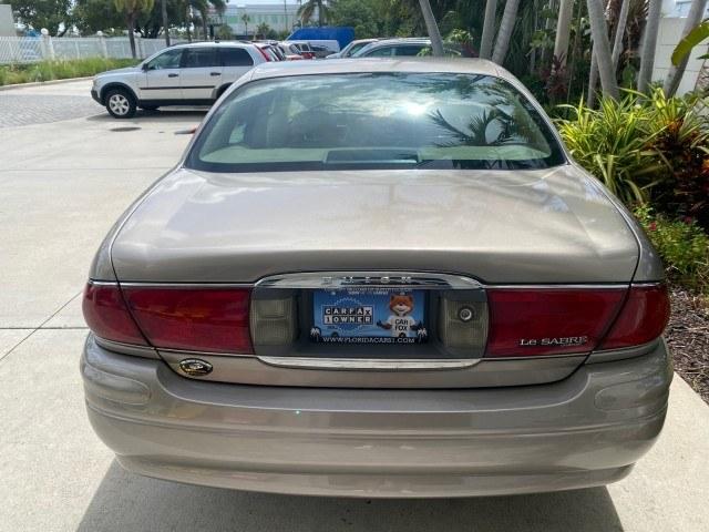 2004 Light Bronzemist Metallic /Cashmere Buick LeSabre Custom LOW MILES 65,489 (1G4HP54K444) with an 3.8L 3800 V6 SFI Engine engine, Automatic transmission, located at 4701 North Dixie Hwy, Pompano Beach, FL, 33064, (954) 422-2889, 26.240938, -80.123474 - OUR WEBPAGE FLORIDACARS1.COM HAS OVER 100 PHOTOS AND FREE CARFAX LINK 2004 Buick Lesabre Custom Sedan 4 DR 3.8L V6 F OHV Gasoline 29 MPG Front Wheel Drive Features ABS Brakes Air Conditioning Alloy Wheels AM/FM Stereo Automatic Transmission Cassette Player CD Audio Cloth Seats Cruise Control Power L- Photo#35