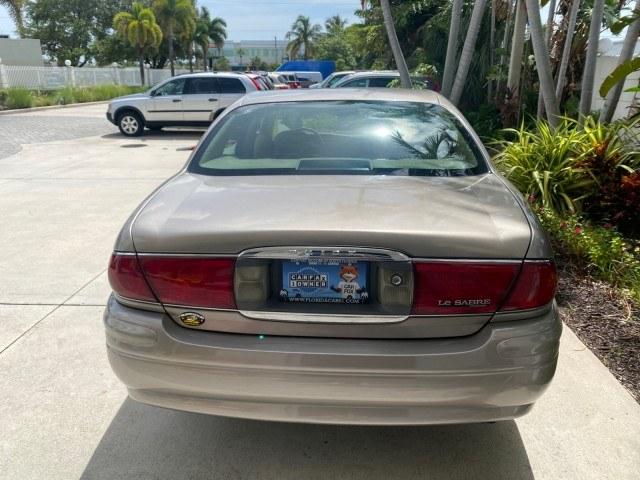 2004 Light Bronzemist Metallic /Cashmere Buick LeSabre Custom LOW MILES 65,489 (1G4HP54K444) with an 3.8L 3800 V6 SFI Engine engine, Automatic transmission, located at 4701 North Dixie Hwy, Pompano Beach, FL, 33064, (954) 422-2889, 26.240938, -80.123474 - OUR WEBPAGE FLORIDACARS1.COM HAS OVER 100 PHOTOS AND FREE CARFAX LINK 2004 Buick Lesabre Custom Sedan 4 DR 3.8L V6 F OHV Gasoline 29 MPG Front Wheel Drive Features ABS Brakes Air Conditioning Alloy Wheels AM/FM Stereo Automatic Transmission Cassette Player CD Audio Cloth Seats Cruise Control Power L- Photo#90