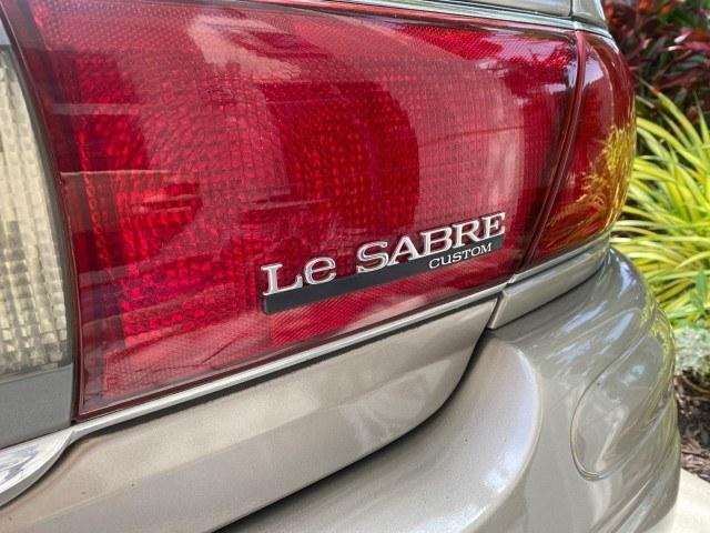 2004 Light Bronzemist Metallic /Cashmere Buick LeSabre Custom LOW MILES 65,489 (1G4HP54K444) with an 3.8L 3800 V6 SFI Engine engine, Automatic transmission, located at 4701 North Dixie Hwy, Pompano Beach, FL, 33064, (954) 422-2889, 26.240938, -80.123474 - OUR WEBPAGE FLORIDACARS1.COM HAS OVER 100 PHOTOS AND FREE CARFAX LINK 2004 Buick Lesabre Custom Sedan 4 DR 3.8L V6 F OHV Gasoline 29 MPG Front Wheel Drive Features ABS Brakes Air Conditioning Alloy Wheels AM/FM Stereo Automatic Transmission Cassette Player CD Audio Cloth Seats Cruise Control Power L- Photo#92
