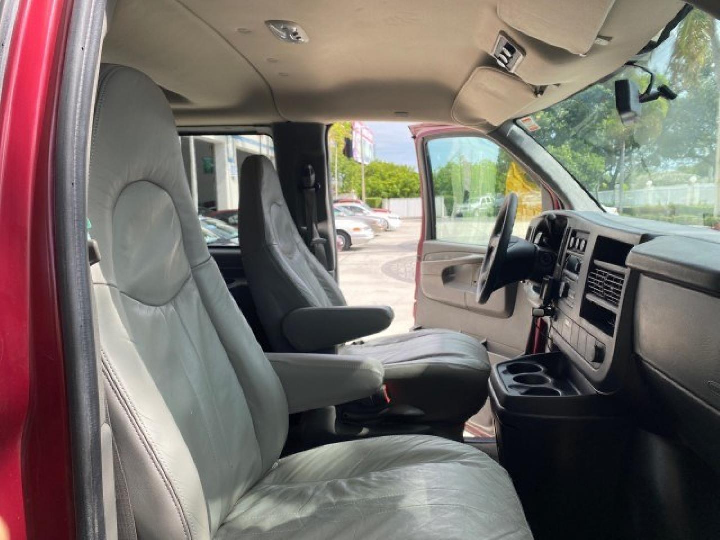 2009 Sport Red Metallic /Medium Pewter GMC Savana Passenger LOW MILES 53,014 1 OWNER 8 Passenger (1GKFG154891) with an 5.3L Vortec 1000 V8 SFI Engine engine, Automatic transmission, located at 4701 North Dixie Hwy, Pompano Beach, FL, 33064, (954) 422-2889, 26.240938, -80.123474 - OUR WEBPAGE FLORIDACARS1.COM HAS OVER 100 PHOTOS AND FREE CARFAX LINK 2009 GMC Savana LS 1500 1 OWNER 8 PASSENGER Van 5.3L V8 F OHV 16V Flex Fuel 16 MPG Rear Wheel Drive Features ABS Brakes Air Conditioning AM/FM Stereo Automatic Transmission CD Audio Cloth Seats Cruise Control Overhead Airbags Powe- Photo#12