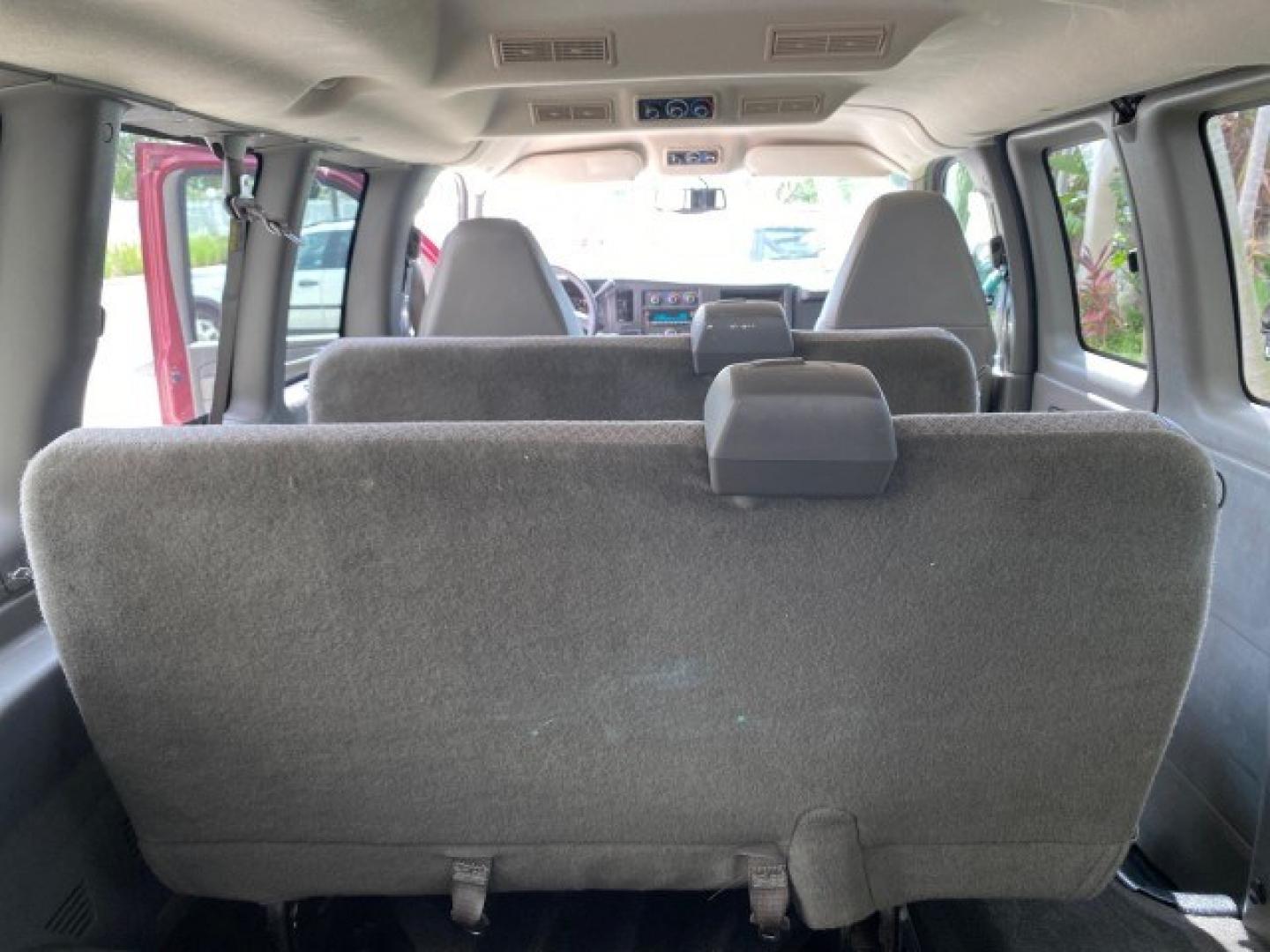 2009 Sport Red Metallic /Medium Pewter GMC Savana Passenger LOW MILES 53,014 1 OWNER 8 Passenger (1GKFG154891) with an 5.3L Vortec 1000 V8 SFI Engine engine, Automatic transmission, located at 4701 North Dixie Hwy, Pompano Beach, FL, 33064, (954) 422-2889, 26.240938, -80.123474 - OUR WEBPAGE FLORIDACARS1.COM HAS OVER 100 PHOTOS AND FREE CARFAX LINK 2009 GMC Savana LS 1500 1 OWNER 8 PASSENGER Van 5.3L V8 F OHV 16V Flex Fuel 16 MPG Rear Wheel Drive Features ABS Brakes Air Conditioning AM/FM Stereo Automatic Transmission CD Audio Cloth Seats Cruise Control Overhead Airbags Powe- Photo#76