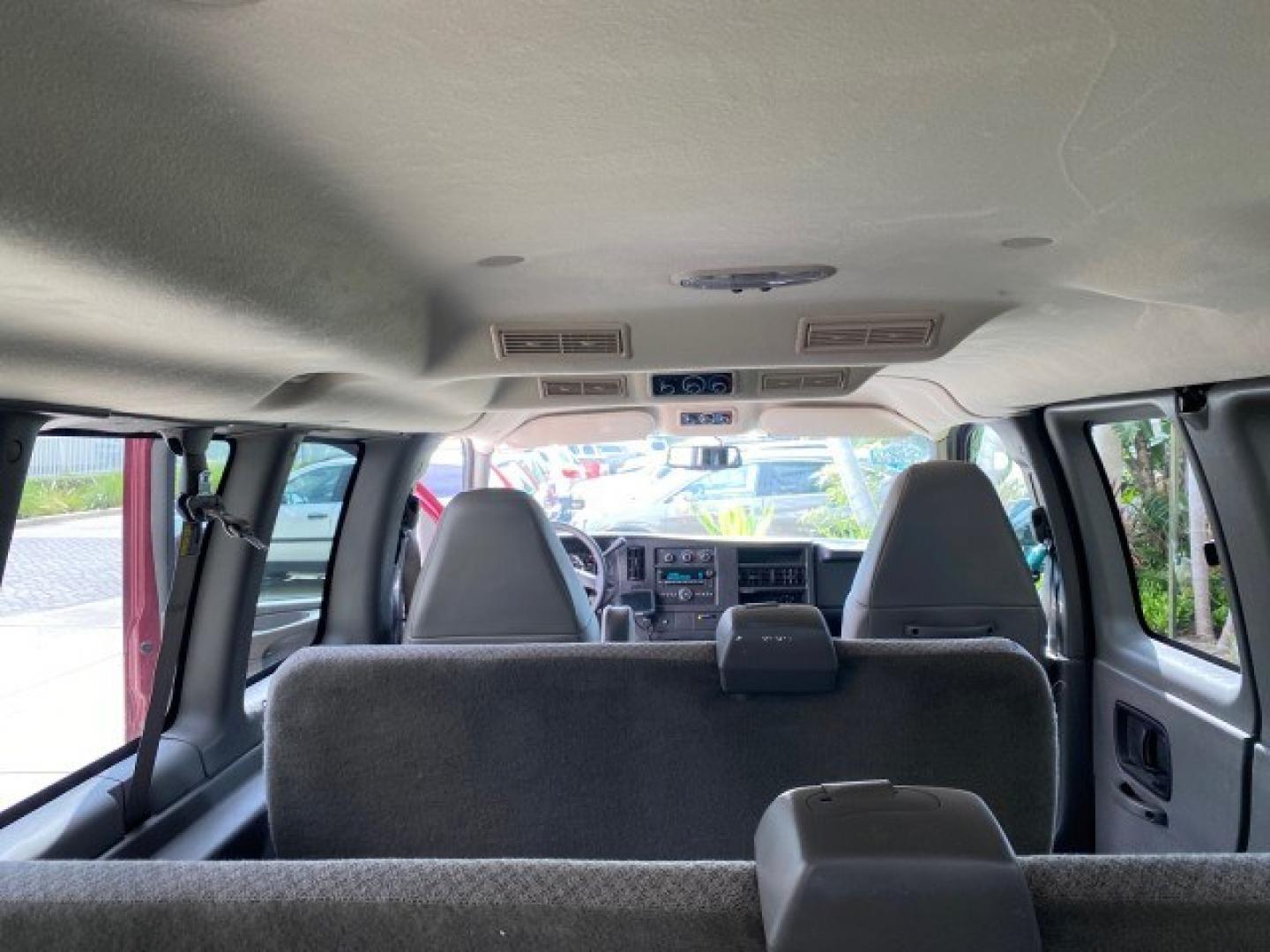 2009 Sport Red Metallic /Medium Pewter GMC Savana Passenger LOW MILES 53,014 1 OWNER 8 Passenger (1GKFG154891) with an 5.3L Vortec 1000 V8 SFI Engine engine, Automatic transmission, located at 4701 North Dixie Hwy, Pompano Beach, FL, 33064, (954) 422-2889, 26.240938, -80.123474 - OUR WEBPAGE FLORIDACARS1.COM HAS OVER 100 PHOTOS AND FREE CARFAX LINK 2009 GMC Savana LS 1500 1 OWNER 8 PASSENGER Van 5.3L V8 F OHV 16V Flex Fuel 16 MPG Rear Wheel Drive Features ABS Brakes Air Conditioning AM/FM Stereo Automatic Transmission CD Audio Cloth Seats Cruise Control Overhead Airbags Powe- Photo#80