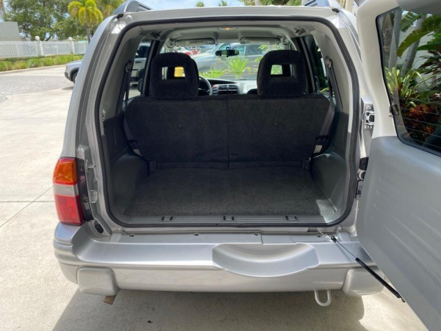 2003 Silver Leaf Metallic /Medium Gray Chevrolet Tracker LT LOW MILES 45,920 1 OWNER (2CNBE634X36) with an 2.5L DOHC 24-Valve V6 Multi-Port Fuel Injection Engine engine, Automatic transmission, located at 4701 North Dixie Hwy, Pompano Beach, FL, 33064, (954) 422-2889, 26.240938, -80.123474 - OUR WEBPAGE FLORIDACARS1.COM HAS OVER 100 PHOTOS AND FREE CARFAX LINK 2003 Chevrolet Tracker LT 1 OWNER 4 Door Wagon/Sport Utility 2.5L V6 F DOHC Gasoline 21 MPG Rear Wheel Drive Features Air Conditioning AM/FM Stereo Automatic Transmission CD Audio Cloth Seats Power Locks Power Mirrors Power Window- Photo#92