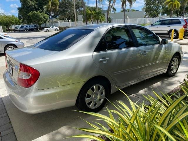 2003 Lunar Mist Metallic /Stone Toyota Camry AC AUTO LE LOW MILES 66,649 (4T1BE32K23U) with an 2.4L DOHC Vvti 16-Valve 4-Cyl Engine engine, Automatic transmission, located at 4701 North Dixie Hwy, Pompano Beach, FL, 33064, (954) 422-2889, 26.240938, -80.123474 - OUR WEBPAGE FLORIDACARS1.COM HAS OVER 100 PHOTOS AND FREE CARFAX LINK 2003 Toyota Camry LE Sedan 4 DR 2.4L I4 F DOHC 16V Gasoline 32 MPG Front Wheel Drive Features Air Conditioning AM/FM Stereo Automatic Transmission Cassette Player CD Audio Cloth Seats Cruise Control Power Locks Power Mirrors Power- Photo#7