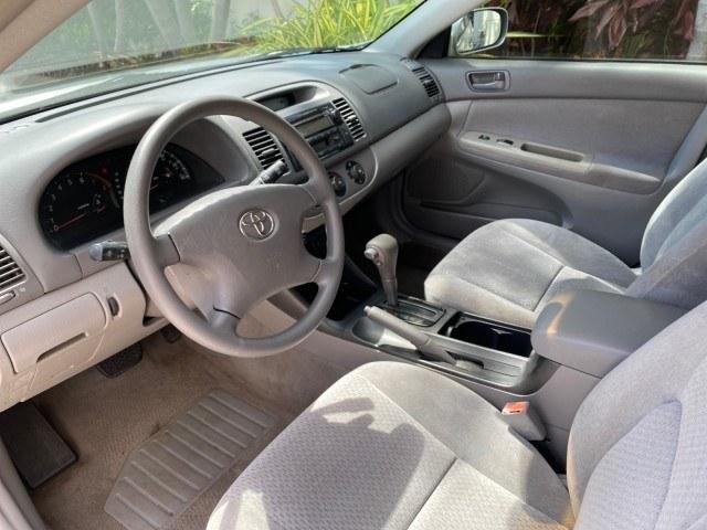 2003 Lunar Mist Metallic /Stone Toyota Camry AC AUTO LE LOW MILES 66,649 (4T1BE32K23U) with an 2.4L DOHC Vvti 16-Valve 4-Cyl Engine engine, Automatic transmission, located at 4701 North Dixie Hwy, Pompano Beach, FL, 33064, (954) 422-2889, 26.240938, -80.123474 - OUR WEBPAGE FLORIDACARS1.COM HAS OVER 100 PHOTOS AND FREE CARFAX LINK 2003 Toyota Camry LE Sedan 4 DR 2.4L I4 F DOHC 16V Gasoline 32 MPG Front Wheel Drive Features Air Conditioning AM/FM Stereo Automatic Transmission Cassette Player CD Audio Cloth Seats Cruise Control Power Locks Power Mirrors Power- Photo#46