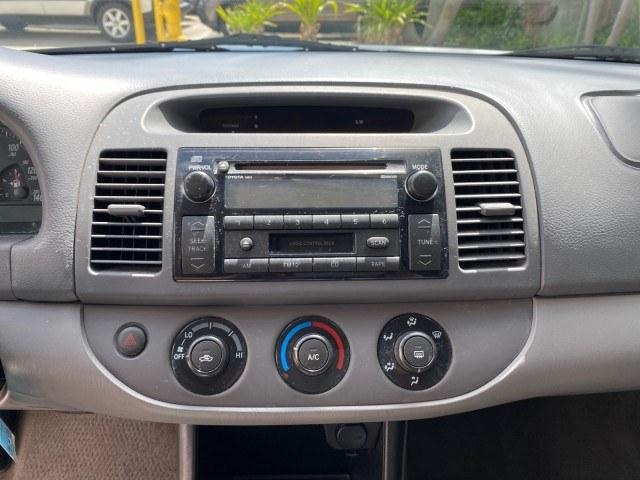 2003 Lunar Mist Metallic /Stone Toyota Camry AC AUTO LE LOW MILES 66,649 (4T1BE32K23U) with an 2.4L DOHC Vvti 16-Valve 4-Cyl Engine engine, Automatic transmission, located at 4701 North Dixie Hwy, Pompano Beach, FL, 33064, (954) 422-2889, 26.240938, -80.123474 - OUR WEBPAGE FLORIDACARS1.COM HAS OVER 100 PHOTOS AND FREE CARFAX LINK 2003 Toyota Camry LE Sedan 4 DR 2.4L I4 F DOHC 16V Gasoline 32 MPG Front Wheel Drive Features Air Conditioning AM/FM Stereo Automatic Transmission Cassette Player CD Audio Cloth Seats Cruise Control Power Locks Power Mirrors Power- Photo#56