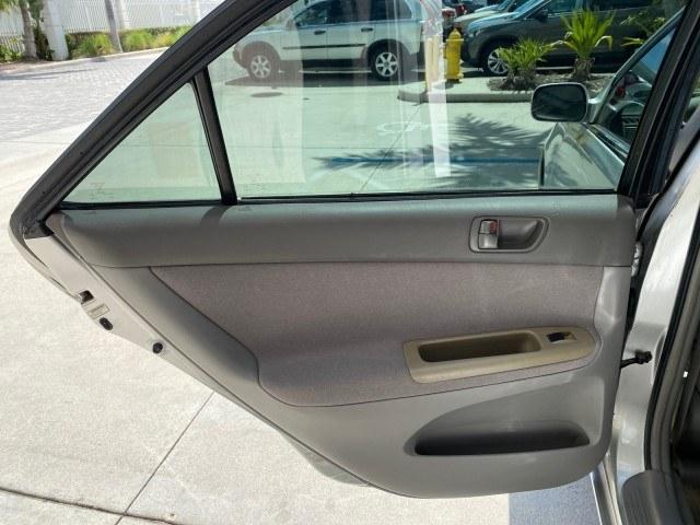 2003 Lunar Mist Metallic /Stone Toyota Camry AC AUTO LE LOW MILES 66,649 (4T1BE32K23U) with an 2.4L DOHC Vvti 16-Valve 4-Cyl Engine engine, Automatic transmission, located at 4701 North Dixie Hwy, Pompano Beach, FL, 33064, (954) 422-2889, 26.240938, -80.123474 - OUR WEBPAGE FLORIDACARS1.COM HAS OVER 100 PHOTOS AND FREE CARFAX LINK 2003 Toyota Camry LE Sedan 4 DR 2.4L I4 F DOHC 16V Gasoline 32 MPG Front Wheel Drive Features Air Conditioning AM/FM Stereo Automatic Transmission Cassette Player CD Audio Cloth Seats Cruise Control Power Locks Power Mirrors Power- Photo#74