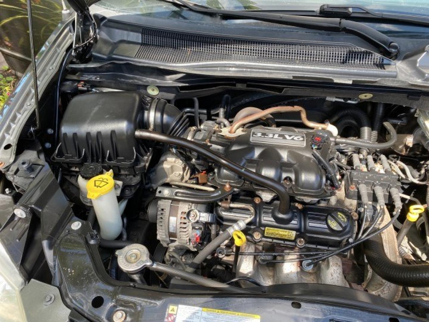 2010 Dark Titanium Metallic /Medium Slate Gray/Light Shale Dodge Grand Caravan SE LOW MILES 36,541 (2D4RN4DE9AR) with an 3.3L OHV V6 Engine engine, Automatic transmission, located at 4701 North Dixie Hwy, Pompano Beach, FL, 33064, (954) 422-2889, 26.240938, -80.123474 - OUR WEBPAGE FLORIDACARS1.COM HAS OVER 100 PHOTOS AND FREE CARFAX LINK 2010 Dodge Grand Caravan SE Van 3.3L V6 F OHV 12V Gasoline 24 MPG Front Wheel Drive Features ABS Brakes Air Conditioning AM/FM Stereo Automatic Transmission Auxiliary Audio Input CD Audio Cloth Seats Cruise Control Flex Fuel Vehic- Photo#24