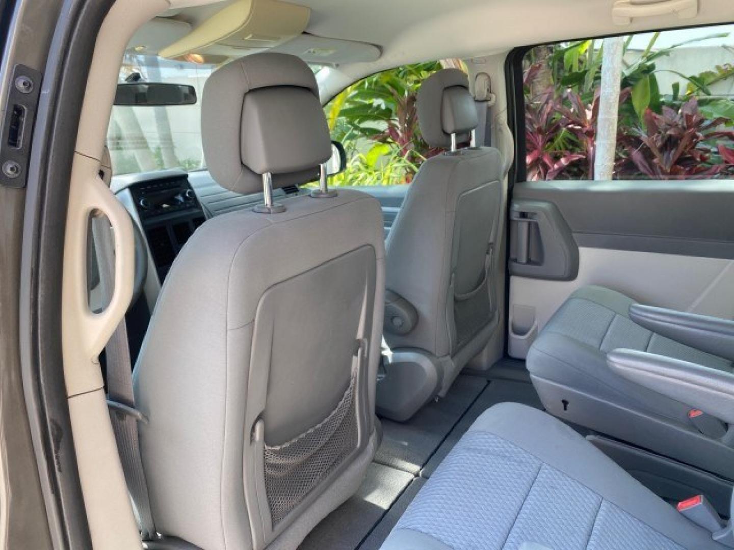 2010 Dark Titanium Metallic /Medium Slate Gray/Light Shale Dodge Grand Caravan SE LOW MILES 36,541 (2D4RN4DE9AR) with an 3.3L OHV V6 Engine engine, Automatic transmission, located at 4701 North Dixie Hwy, Pompano Beach, FL, 33064, (954) 422-2889, 26.240938, -80.123474 - OUR WEBPAGE FLORIDACARS1.COM HAS OVER 100 PHOTOS AND FREE CARFAX LINK 2010 Dodge Grand Caravan SE Van 3.3L V6 F OHV 12V Gasoline 24 MPG Front Wheel Drive Features ABS Brakes Air Conditioning AM/FM Stereo Automatic Transmission Auxiliary Audio Input CD Audio Cloth Seats Cruise Control Flex Fuel Vehic- Photo#76