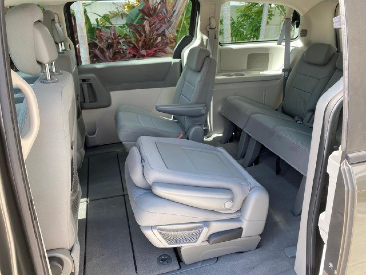 2010 Dark Titanium Metallic /Medium Slate Gray/Light Shale Dodge Grand Caravan SE LOW MILES 36,541 (2D4RN4DE9AR) with an 3.3L OHV V6 Engine engine, Automatic transmission, located at 4701 North Dixie Hwy, Pompano Beach, FL, 33064, (954) 422-2889, 26.240938, -80.123474 - OUR WEBPAGE FLORIDACARS1.COM HAS OVER 100 PHOTOS AND FREE CARFAX LINK 2010 Dodge Grand Caravan SE Van 3.3L V6 F OHV 12V Gasoline 24 MPG Front Wheel Drive Features ABS Brakes Air Conditioning AM/FM Stereo Automatic Transmission Auxiliary Audio Input CD Audio Cloth Seats Cruise Control Flex Fuel Vehic- Photo#80