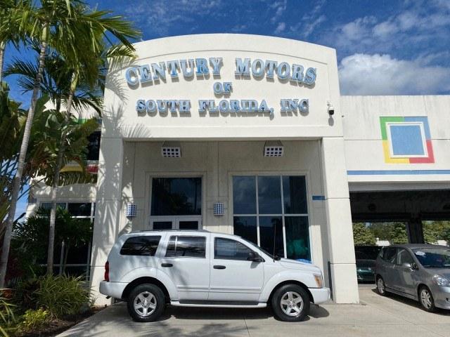 2004 Bright White /Med Slate Gray Dodge Durango Limited LOW MILES 55,294 (1D4HD58N24F) with an 4.7L V8 Magnum Engine engine, Automatic transmission, located at 4701 North Dixie Hwy, Pompano Beach, FL, 33064, (954) 422-2889, 26.240938, -80.123474 - OUR WEBPAGE FLORIDACARS1.COM HAS OVER 100 PHOTOS AND FREE CARFAX LINK 2004 Dodge Durango Limited 4 Door Wagon/Sport Utility 4.7L V8 F Gasoline 18 MPG Rear Wheel Drive Features ABS Brakes Air Conditioning Alloy Wheels AM/FM Stereo Automatic Transmission CD Audio Cruise Control Fold-Away Third Row Lea- Photo#0