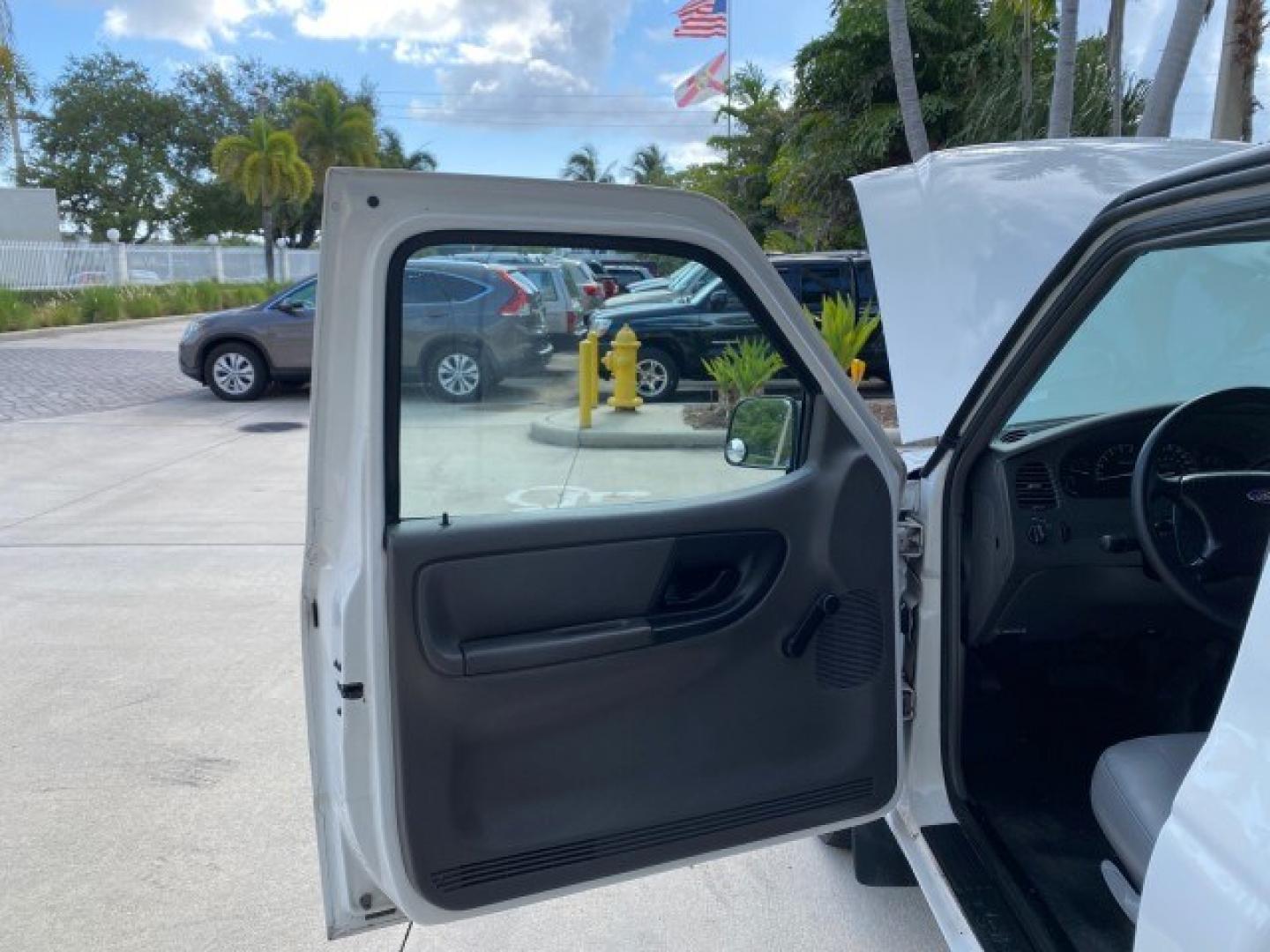 2002 Oxford White /Dark Graphite Ford Ranger XL AUTO AC LOW MILES 40,403 (1FTYR10D42T) with an 2.3L DOHC SEFI 16-Valve 4-Cyl Engine engine, Automatic transmission, located at 4701 North Dixie Hwy, Pompano Beach, FL, 33064, (954) 422-2889, 26.240938, -80.123474 - OUR WEBPAGE FLORIDACARS1.COM HAS OVER 100 PHOTOS AND FREE CARFAX LINK 2002 Ford Ranger XL Pickup 2.3L I4 F Gasoline 28 MPG Rear Wheel Drive Features ABS Brakes Air Conditioning AM/FM Stereo Automatic Transmission Vinyl Seats Power Locks Power Mirrors Power Windows 2002 Ford Ranger XL is a fantastic- Photo#9