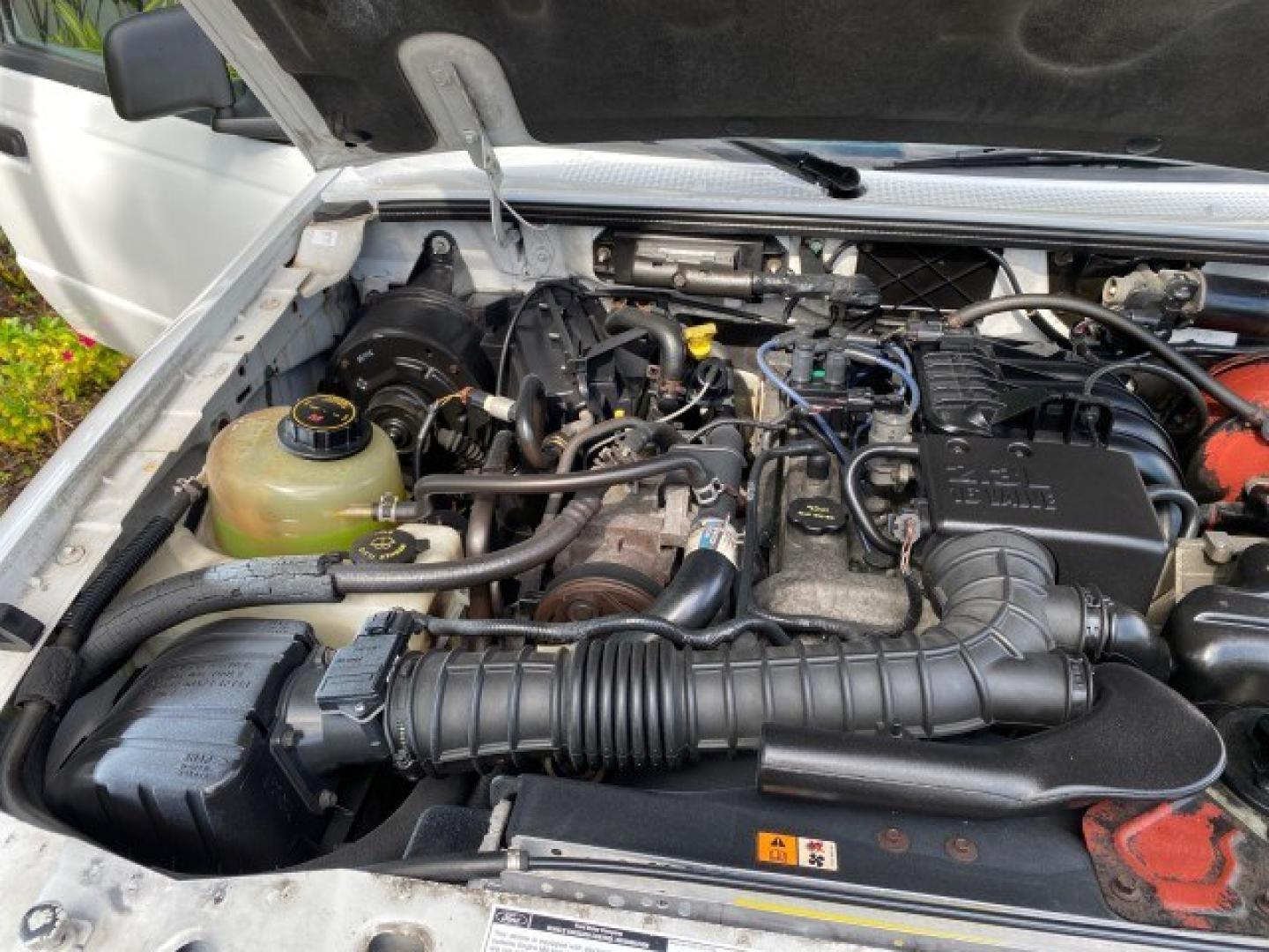2002 Oxford White /Dark Graphite Ford Ranger XL AUTO AC LOW MILES 40,403 (1FTYR10D42T) with an 2.3L DOHC SEFI 16-Valve 4-Cyl Engine engine, Automatic transmission, located at 4701 North Dixie Hwy, Pompano Beach, FL, 33064, (954) 422-2889, 26.240938, -80.123474 - OUR WEBPAGE FLORIDACARS1.COM HAS OVER 100 PHOTOS AND FREE CARFAX LINK 2002 Ford Ranger XL Pickup 2.3L I4 F Gasoline 28 MPG Rear Wheel Drive Features ABS Brakes Air Conditioning AM/FM Stereo Automatic Transmission Vinyl Seats Power Locks Power Mirrors Power Windows 2002 Ford Ranger XL is a fantastic- Photo#24