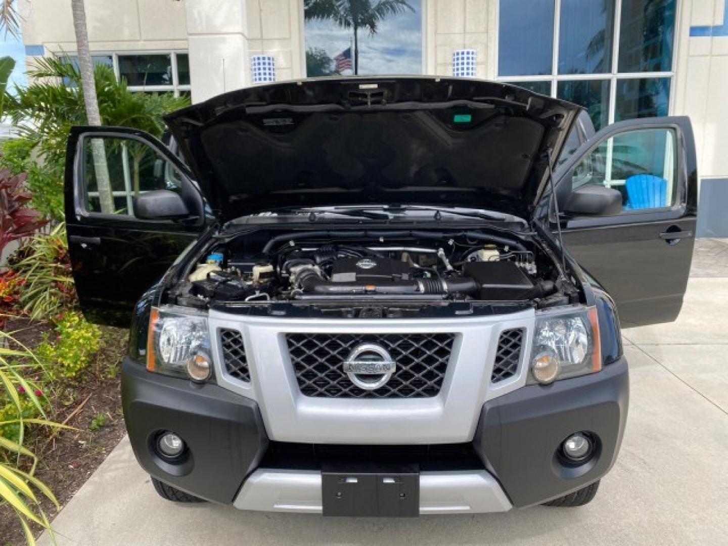 2009 Super Black /Steel Nissan Xterra 6 SPDLOW MILES 50,980 1 OWNER 4WD (5N1AN08W69C) with an 4.0L V6 Cylinder Engine engine, Manual transmission, located at 4701 North Dixie Hwy, Pompano Beach, FL, 33064, (954) 422-2889, 26.240938, -80.123474 - OUR WEBPAGE FLORIDACARS1.COM HAS OVER 100 PHOTOS AND FREE CARFAX LINK 2009 Nissan Xterra S 1 OWNER MANUAL TRANSMISSION 4 Door Wagon/Sport Utility 4.0L V6 F DOHC 24V Gasoline 20 MPG Rear Wheel Drive w/ 4X4 Features 4WD/AWD ABS Brakes Air Conditioning Alloy Wheels AM/FM Stereo Automatic Transmission A- Photo#17